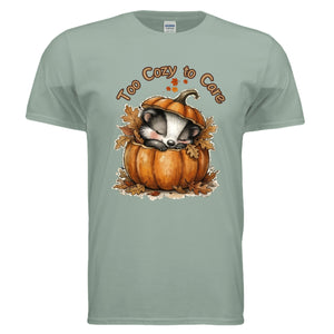 Too Cozy to Care Graphic Tee in sage with front pumpkin design; perfect for showcasing cozy season vibes, fall graphic tee.