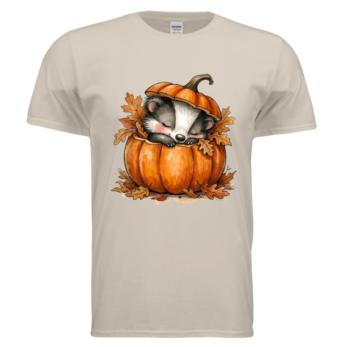 Cozy Badger graphic tee featuring an adorable badger sleeping in a pumpkin with autumn leaves on a sand background.