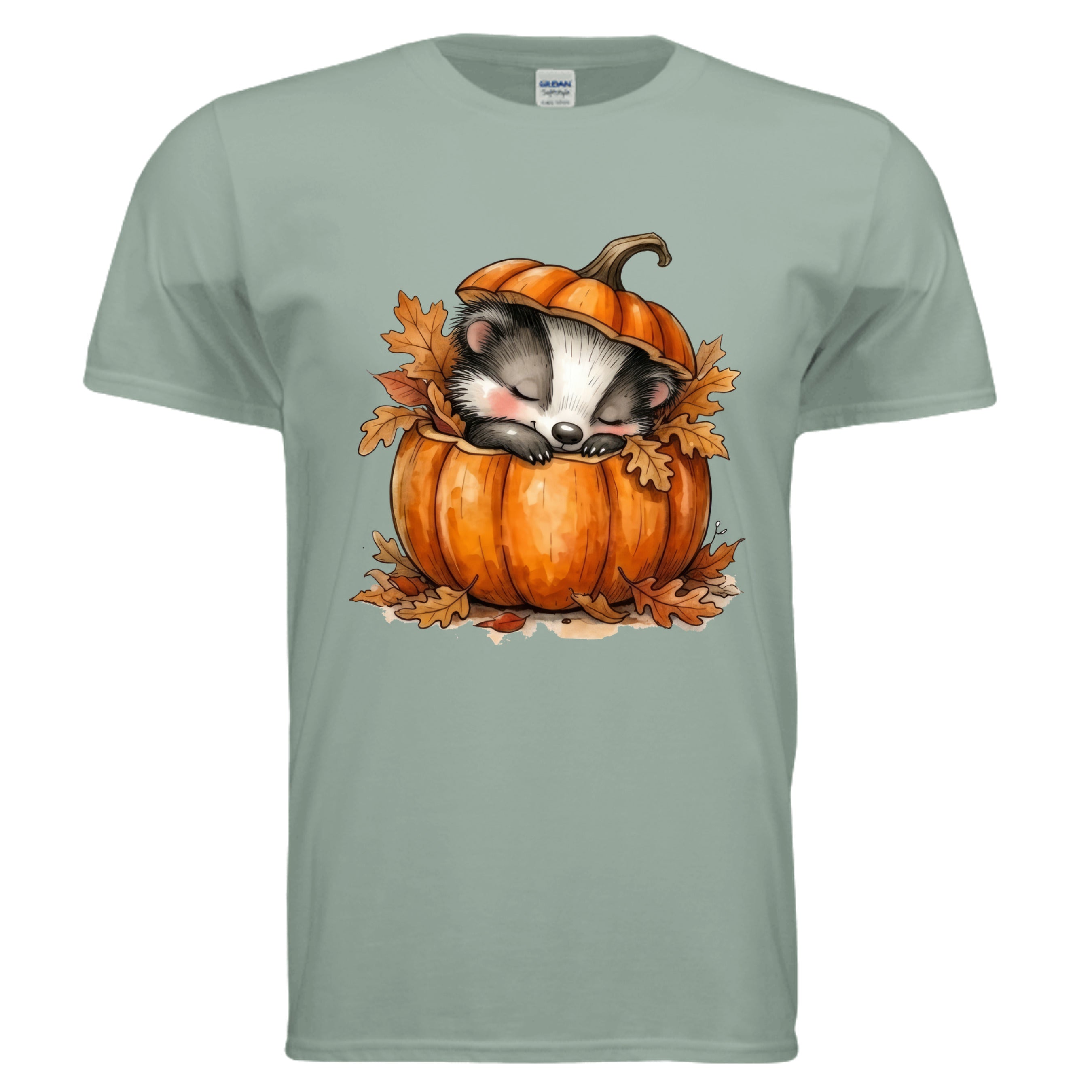 Cozy Badger graphic tee featuring a badger sleeping in a pumpkin with autumn leaves on a sage background.
