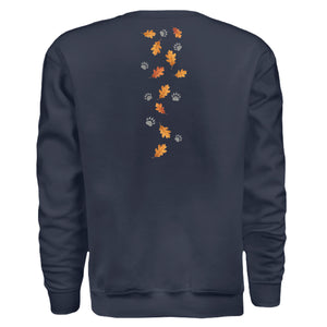Back view of the forest edition badger sweatshirt featuring autumn leaves and paw prints.