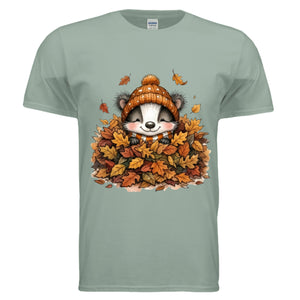 Sage Leaf Pile Badger Tee showcasing fall graphic badger tee design featuring badger in leaves.