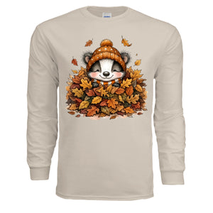 Leaf Pile Badger Long Sleeve Tee in sand color featuring a whimsical badger graphic surrounded by autumn leaves.