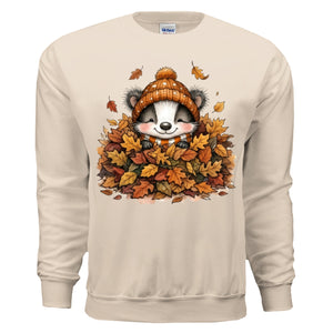 Leaf Pile Badger Sweatshirt in sand color featuring fall graphic sweatshirt with playful badger and autumn leaves design.
