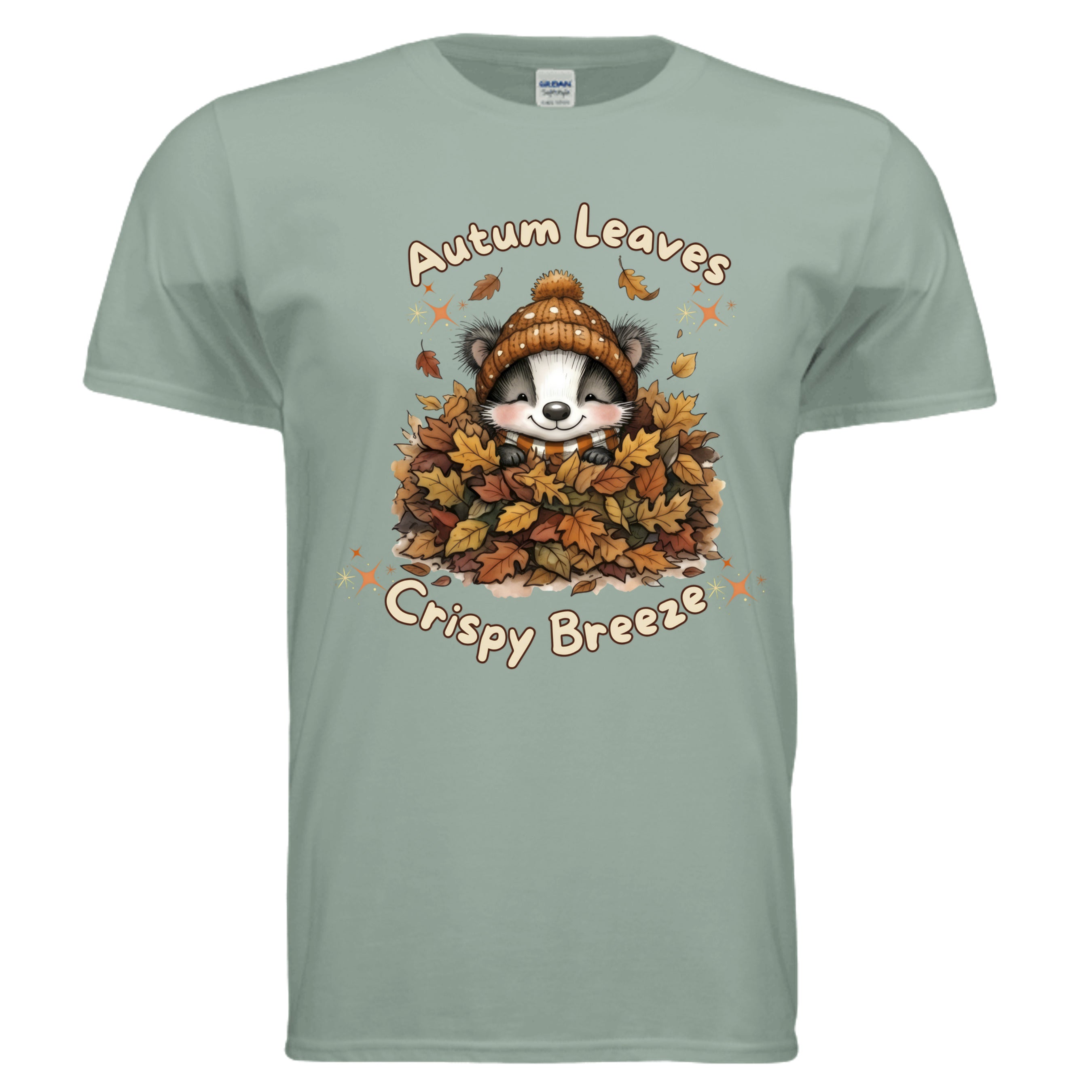 Autumn graphic tee in sage color featuring a cute raccoon surrounded by autumn leaves and the text 'Autumn Leaves Crispy Breeze'.