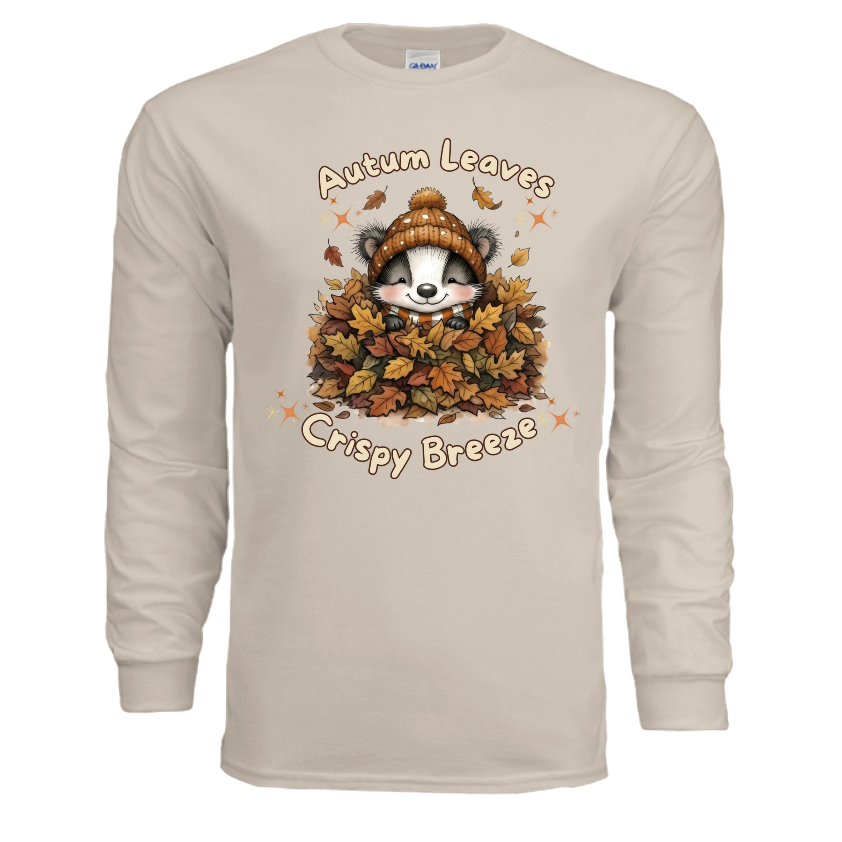 Autumn Leaves Long Sleeve Tee featuring a cute graphic of a raccoon in leaves on a sand colored shirt.