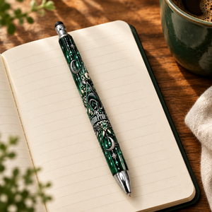 Pen on an open journal in a cozy desk setting